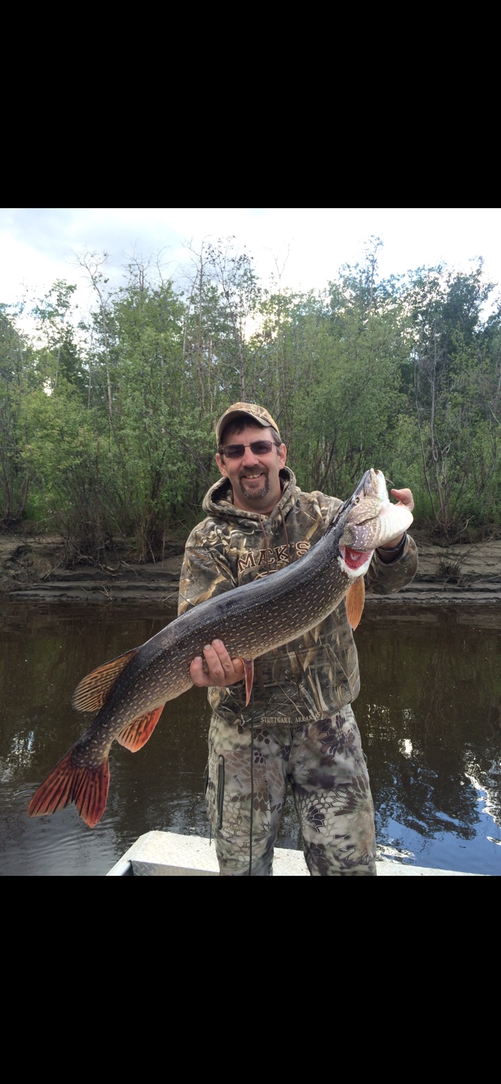 Tom Anderson holding a large northern pike
